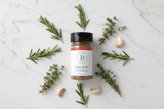 Breeze Blends gluten-free seasoning jar on a white marble countertop with fresh rosemary, thyme, and garlic — all-natural, clean-label spices for gluten-free cooking