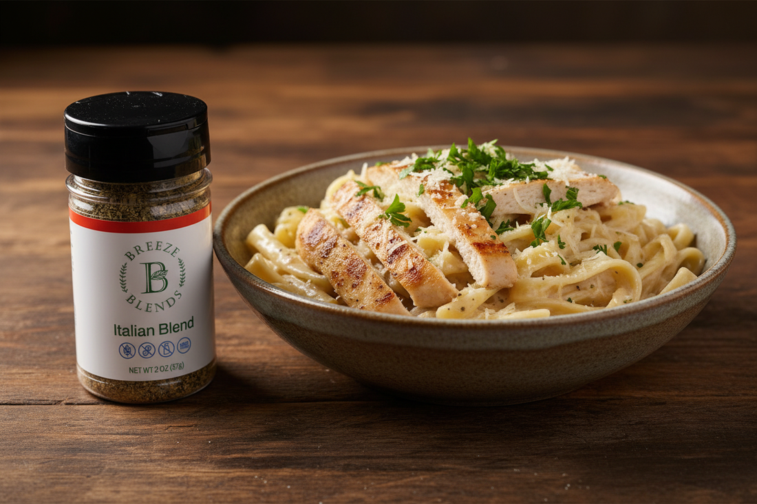 Creamy chicken fettuccine Alfredo with sautéed mushrooms and Breeze Blends Italian Blend seasoning bottle on a rustic wooden table