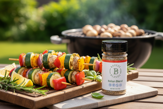Grilled Italian veggie skewers with zucchini, bell peppers, red onion, and mushrooms served with lemon wedges and Breeze Blends Italian Blend seasoning