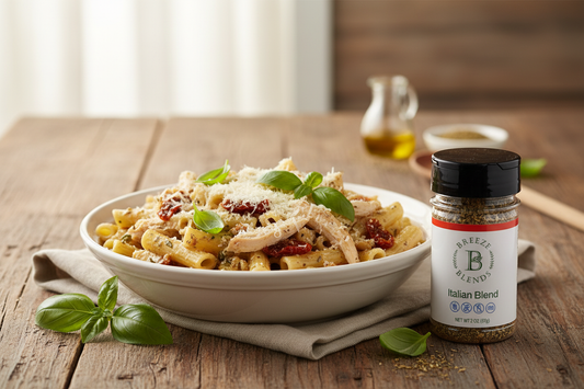 Italian herb chicken pasta in a skillet with diced tomatoes and fresh parmesan, seasoned with Breeze Blends all-natural Italian Blend