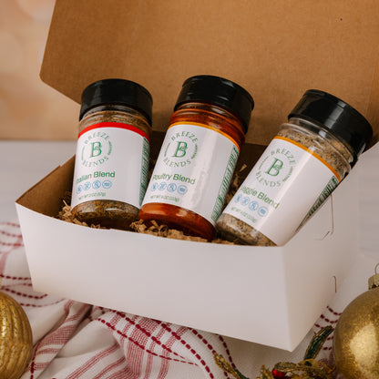 Breeze Blends Tuscan pack inside box with three spice jars with Christmas decorations.